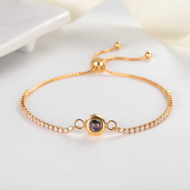 Delicate tennis bracelet with an encrypted pearl