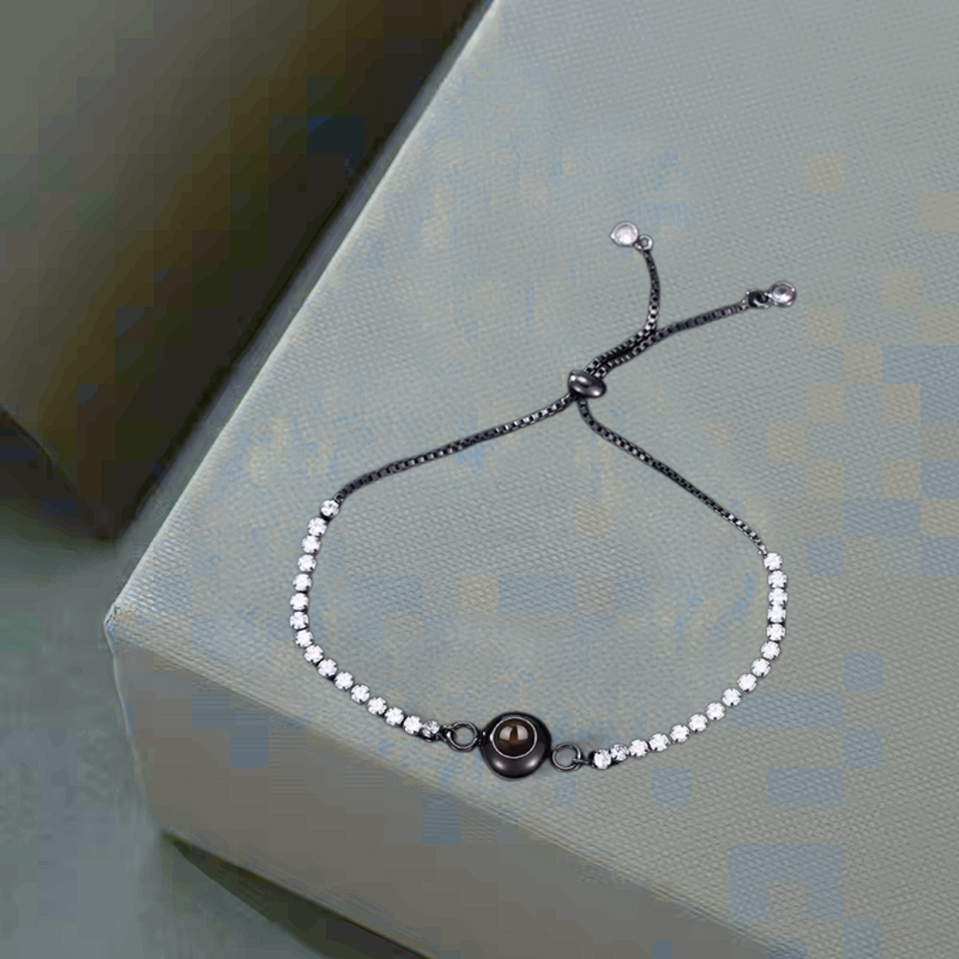 Delicate tennis bracelet with an encrypted pearl